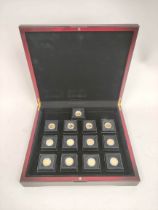 Cased Tristan Da Cunha 2009 commemorative half-crown gold coin set comprising of thirteen 9ct gold