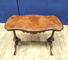 Victorian figured walnut occasional table with shaped top, on turned columns and scroll feet with