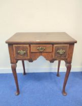 George III walnut lowboy with small centre drawer flanked by deep drawers, on cabriole supports with