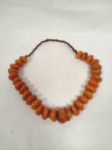 Baltic amber bead necklace of flattened circular beads. 155g
