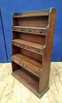 19th Century mahogany waterfall bookcase with open shelving interspersed with three pairs of small