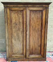 Edwardian inlaid mahogany wardrobe with moulded cornice above two panelled doors on plinth base.