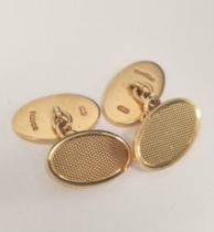 Pair of 9ct. gold oval cufflinks, engine turned. 14.6g