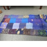 Large modern double patchwork quilt; also a large woven shawl with Paisley pattern decoration.