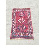 Persian Qashkai style rug with three geometric medallions to the centre with further motifs to the