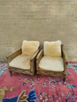 Pair of Regency style hide upholstered low arm chairs, circa early 20th century, with studded