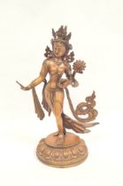 Sino-Tibetan patinated bronze figure of a female deity standing on oval lotus plinth base, 39cm
