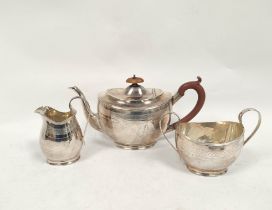 Silver three piece teaset of Georgian style, boat shaped with pin struck band by the Goldsmiths &