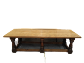 Late 19th century gothic revival oak refectory dining table with baluster supports each carved