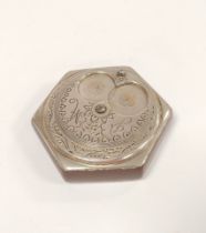 Antique white metal and resin pocket snuff box, the engraved hexagonal revolving top in the form
