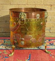 Late Victorian brass and copper jardiniere decorated with beaten roundels and all over chased