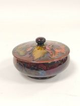 Moorcroft flambe tube lined cylindrical powder jar with cover, stamped & with original label to