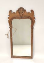 George III style mahogany fret frame wall mirror with scroll decoration, 71cm high, 31cm wide.