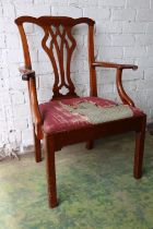 Georgian fruitwood armchair having a shaped top rail above pierced splat, slip in seat, raised on