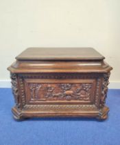 19th century carved oak cellarette, probably Continental origin, of sarcophagus shape with hinged
