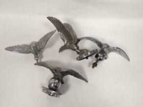 Two Alvis silver eagle mascots, chromed C1932 and two others, two with radiator caps. (4)