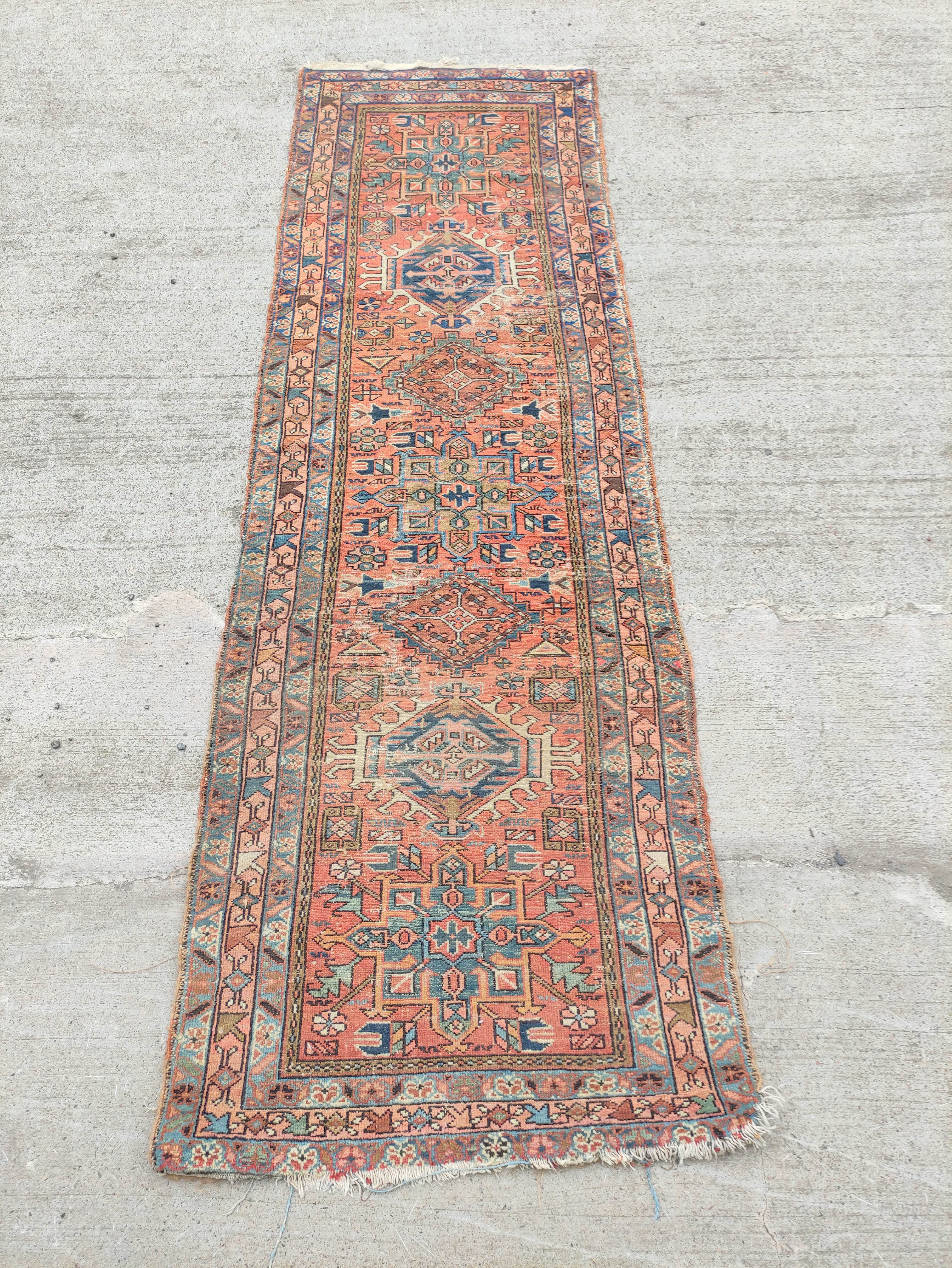 Antique Kurdistan / Turkish hand knotted runner with assorted geometric medallions to the centre