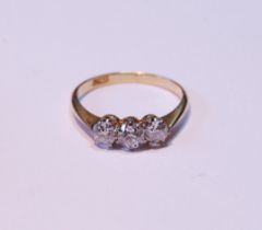 Diamond three-stone ring with old-cut brilliants, the largest .2ct, ‘18ct’, size L.