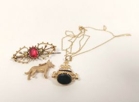 Seal pendant on necklet, a dog pendant and a gem brooch. 9.9g gross.