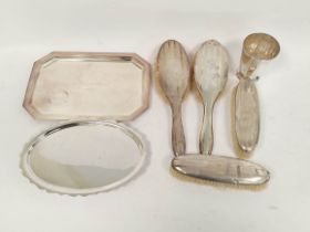 Four silver mounted brushes and an e.p. sauce boat and three similar.