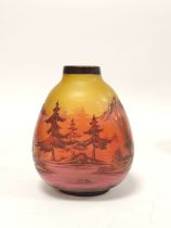 In the manner of Galle Art glass cameo vase, with overlaid woodland scene to the amber coloured