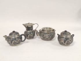 Chinese black pottery and pewter four piece tea service, comprising of tea pot, water pot, small