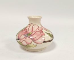 Moorcroft pink hibiscus tube lined vase, of squat size, approximately 11cm high.