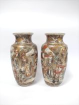 Pair of early 20th Century Japanese Satsuma vases with figures in typical colours with scenes of