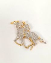 9ct gold racehorse and jockey brooch set with eight-cut diamonds. 6.6g