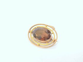 Citrine oval brooch in gold, probably 9ct. C1920