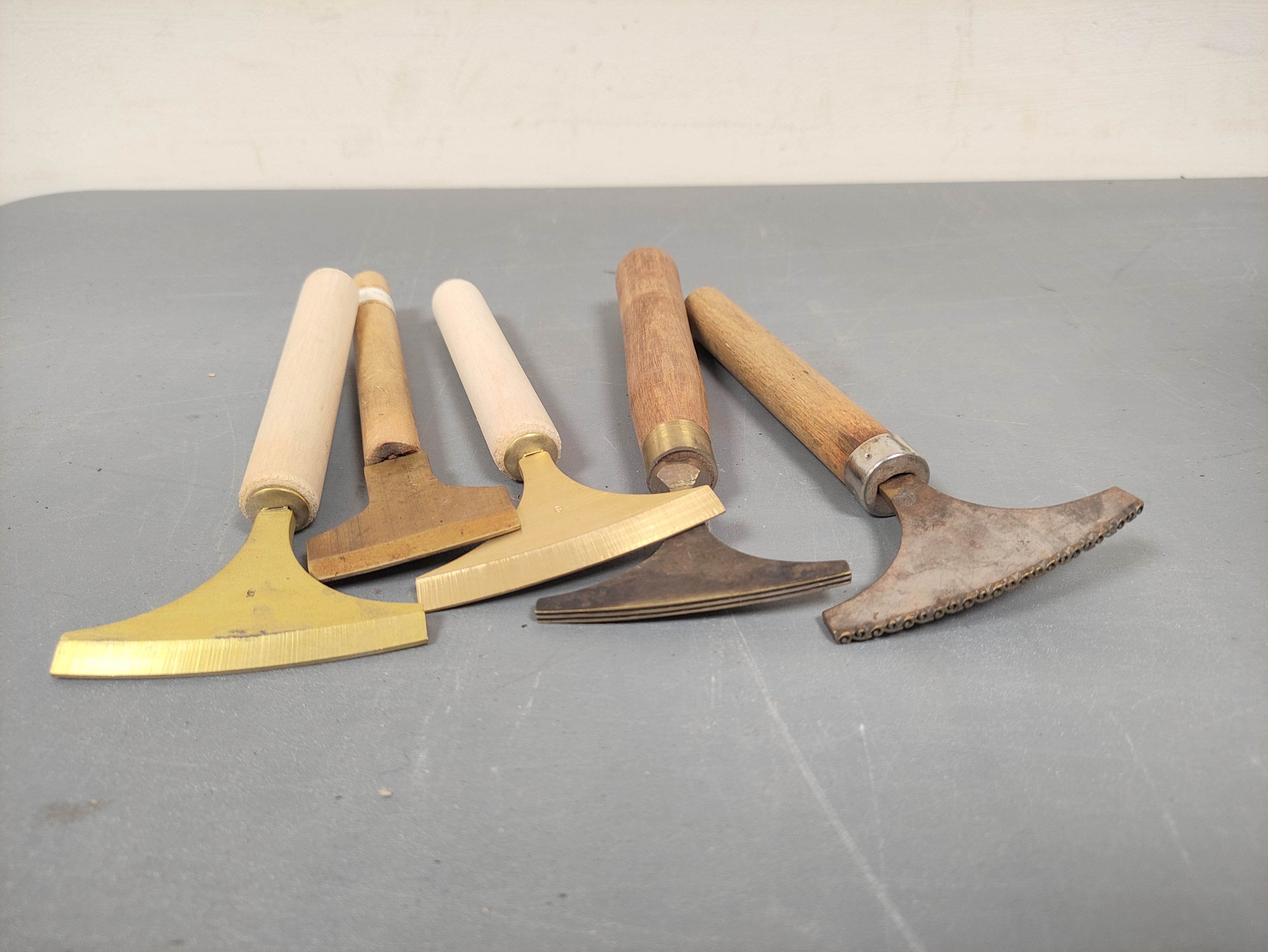 Ten bookbinding brass gilding hand pallets with wooden handles. The edges mostly plain. - Image 2 of 4