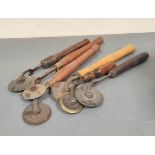 Six bookbinding brass gilding wheels / rollers, with wooden handles. Plain bladed edges. (6)