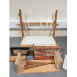 Bookbinding adjustable sewing frame and various rests.