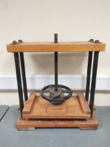 Table top book press with turned thread screw and wheel handle. Height 60cm