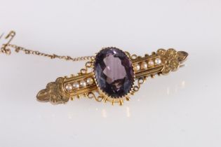 Victorian yellow metal brooch set with large faceted oval amethyst and seed pearls, no markings, 9.