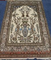 Indian/ Iranian Isfahan style rug, the cream ground decorated with of flowers, animals and trees,