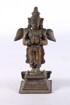 Eastern cast metal model of the Hindu deity Garuda, 18cm tall.