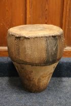 African skin and hide covered drum, 49cm tall, 42cm diameter.