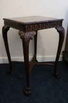 Early 20th century mahogany table in the manner of Gillows, the square top with feather moulded