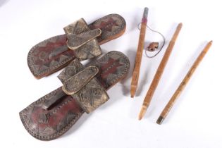 Pair of Eastern leather and stitched thread sandals, 27cm long and a Chinese style two section