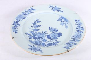 Large Chinese style blue and white tin glazed charger dish decorated with birds on flowering