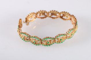 18ct yellow gold bracelet set with emerald green cabochon stones, the clasp stamped '750', 25.2g