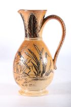 Doulton Lambeth stoneware baluster jug with incised egret and cattail design by Hannah Barlow,