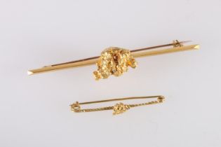 Raw gold nugget set onto a knife edge bar brooch, unhallmarked, 16.2g gross and another smaller, 1g.
