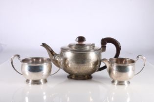 Art Deco silver three-piece tea set, the tea pot with presentation inscription 'PRESENTED TO MRS