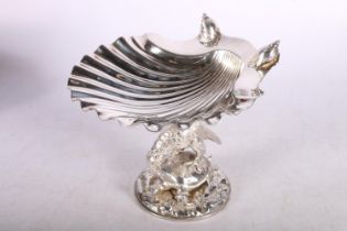 Antique silver dish of shell form, hallmarked London 1837, makers mark rubbed, supported by white