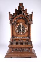 German oak cuckoo clock in architectural castle shaped case, the movement striking on a gong, 67cm