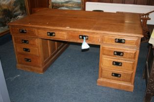 20th century oak partner's desk of typical form, 182cm wide, 121cm deep, 78cm tall.