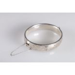 Georg Jensen hinged bangle with foliate decoration to one side hallmarked GJLd, london 1964, 6cm,