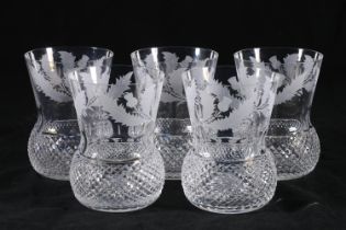 Set of five Edinburgh Crystal thistle shaped drinking glasses with etched thistle pattern, having